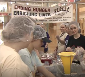 Honors students shown preparing for the Maine Day Meal Packout in 2019