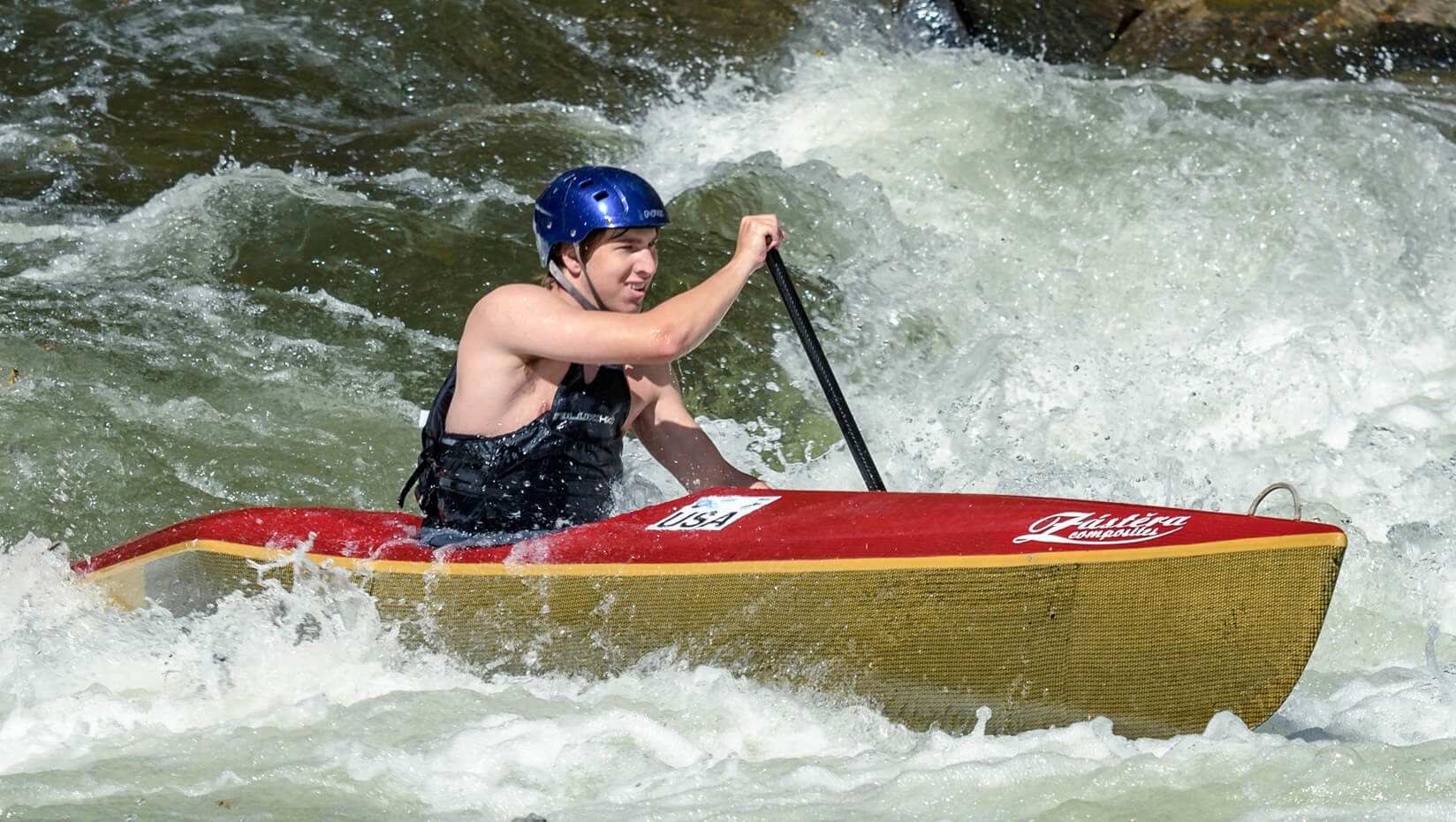 Kell Fremouw shown canoeing in white water.