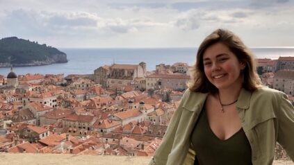 Honors student shown overlooking a city in Croatia while studying abroad.