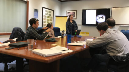 An Honors student gives a presentation at their internship.