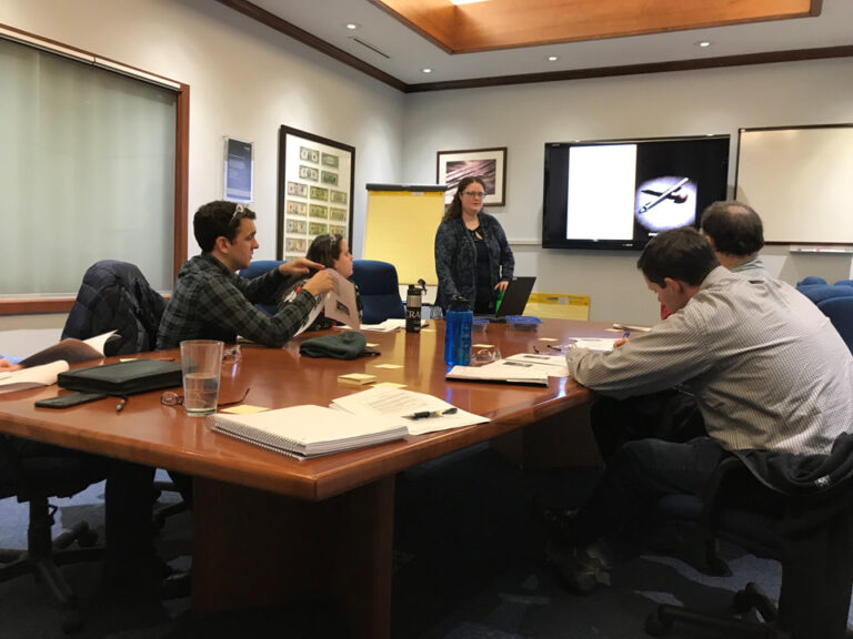 An Honors student gives a presentation at their internship.