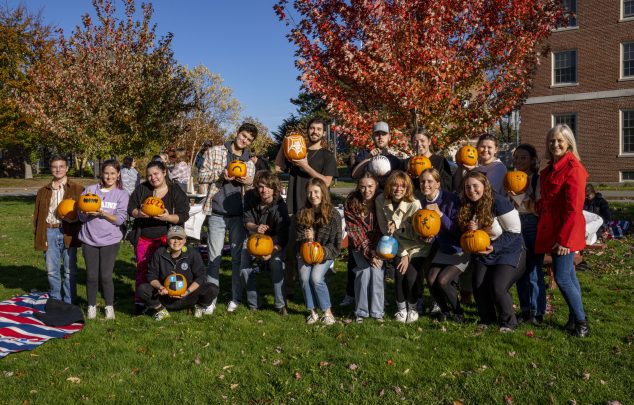 honors students and the dean at pumpkin painting