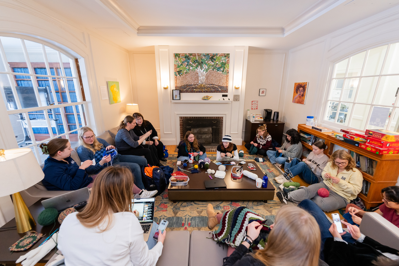 A group of people doing fiber arts
