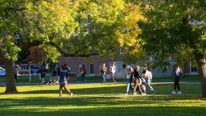 A photo of students walking across the mall